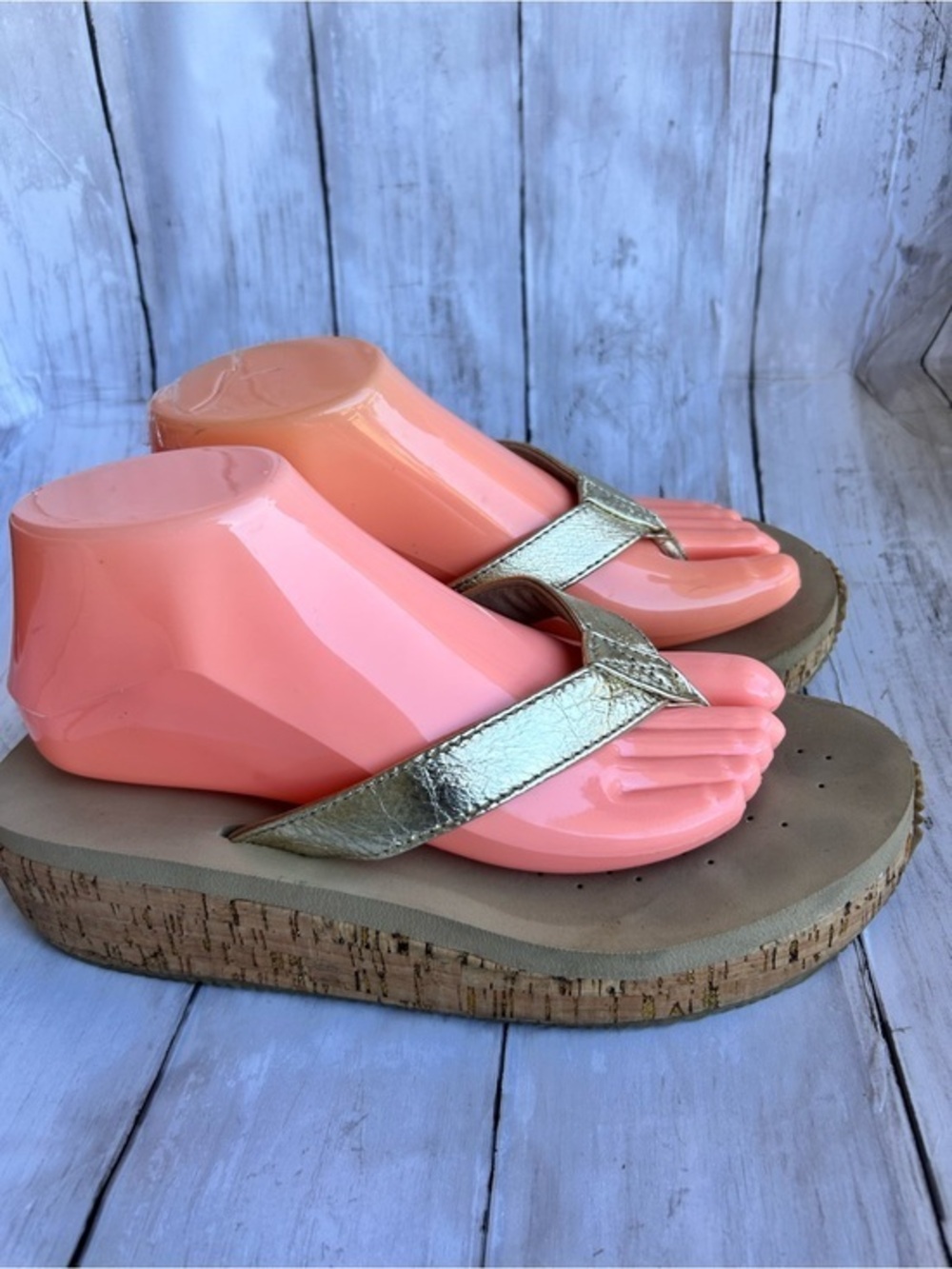 Volatile Gold thong wedge sandals with a cork platform,